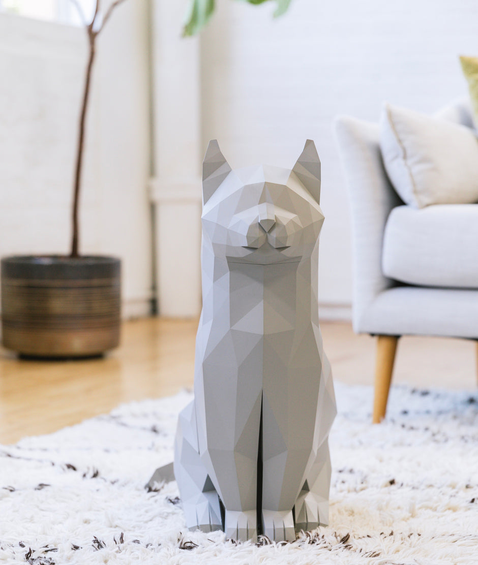 Grey cat-inspired decor and storage piece.